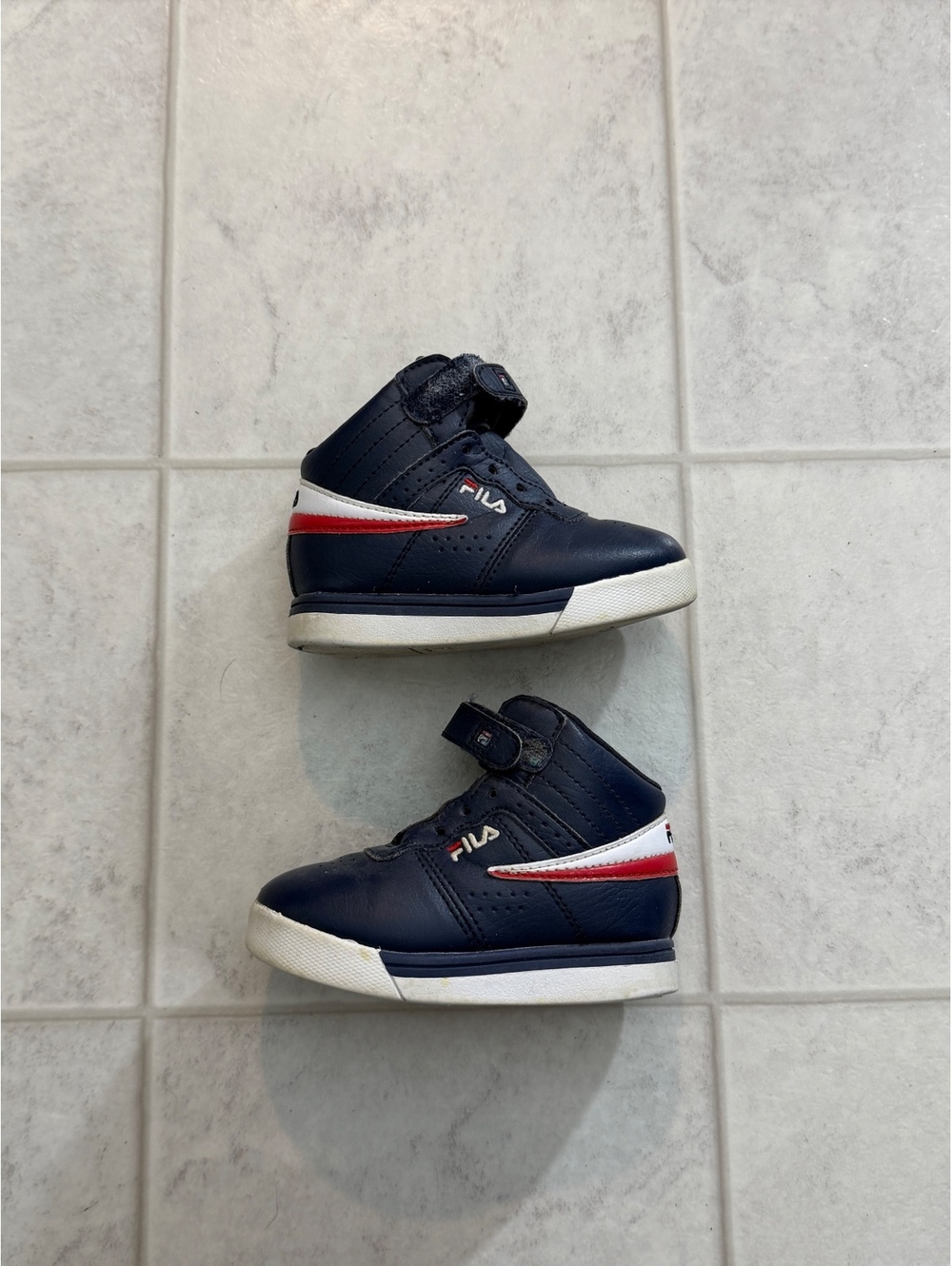 Navy high top sneakers with red and white stripe